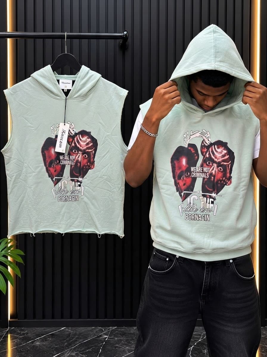 Light green sleeveless cropped hoodie with double graphic and text print shown on model and hanger.