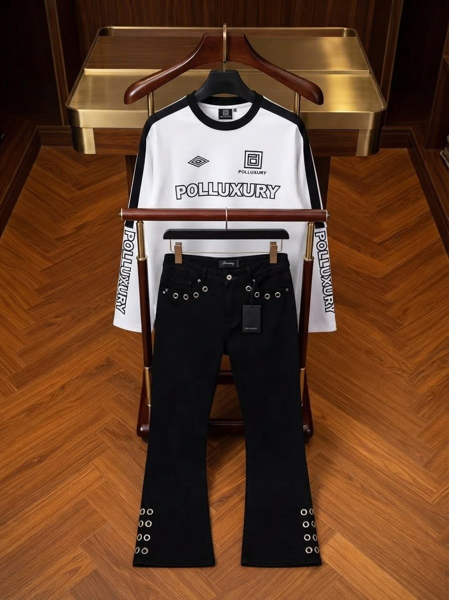 POLLUXURY black long sleeve graphic top with white contrast and black flared pants with silver chain on display stand.
