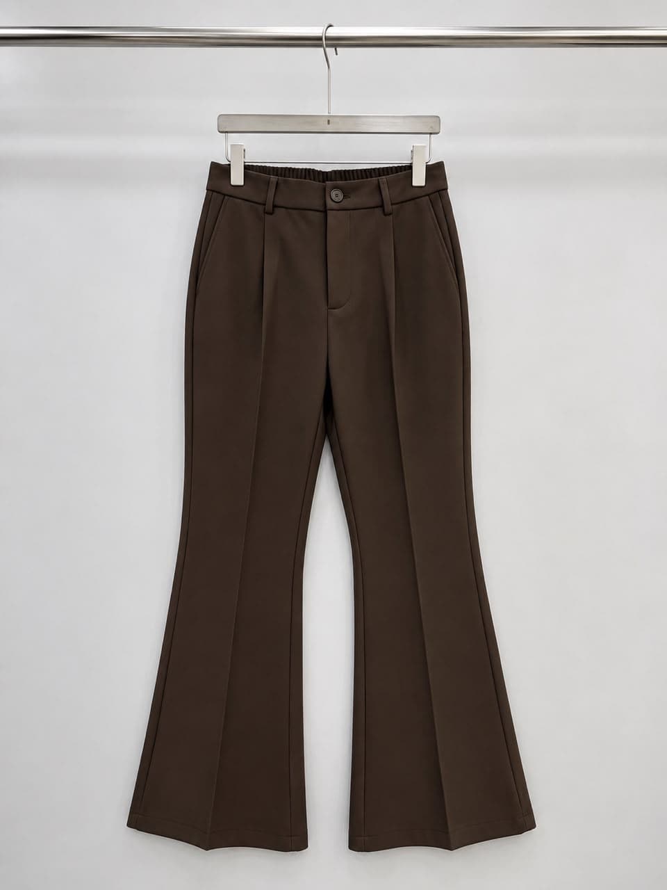 Brown high-waisted flare trousers.