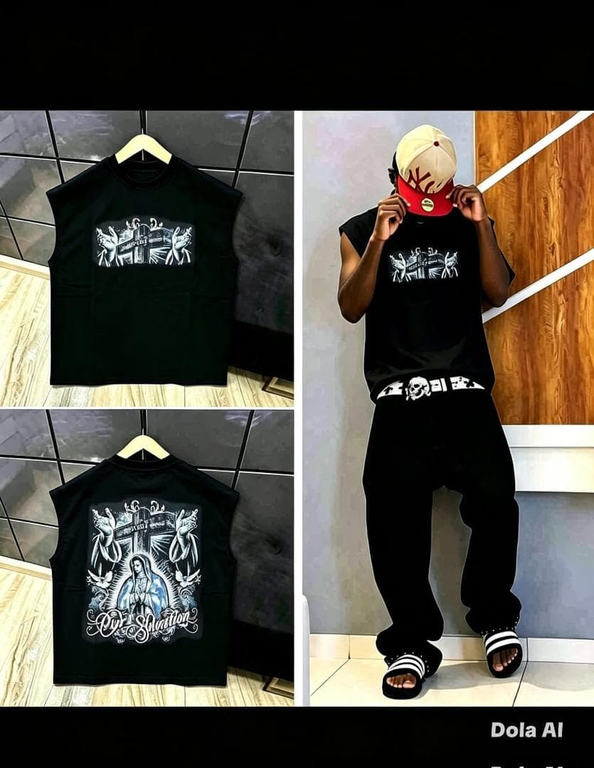 White sleeveless tee with religious cross graphic on front and detailed Virgin Mary 'Our Salvation' print on back, shown on model and hanger.