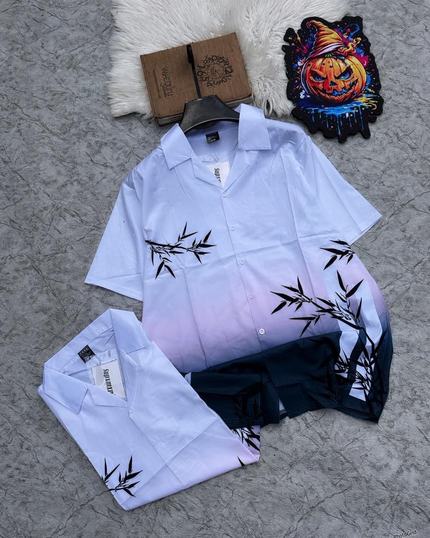 Gradient blue to pink bamboo print shirt and matching shorts laid flat.