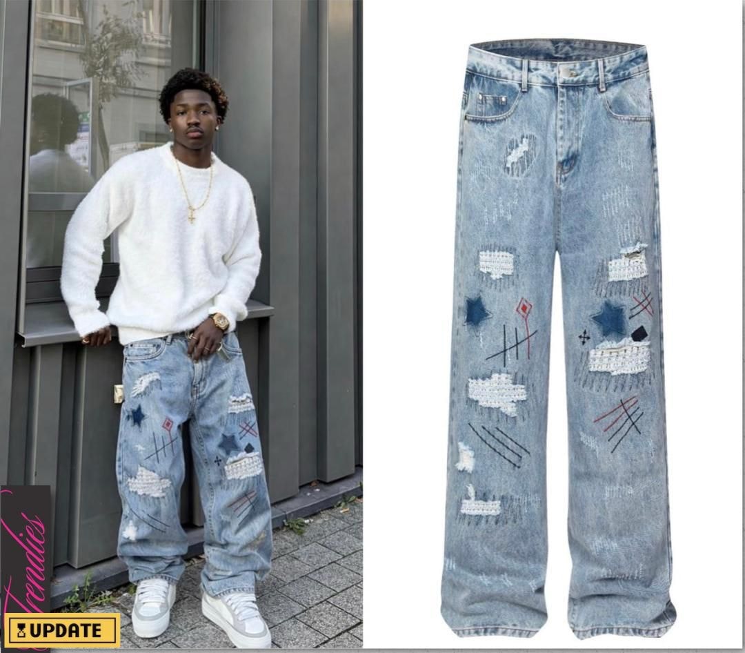 Light blue baggy jeans with patchwork, rips, stars, crosses and embroidery details.