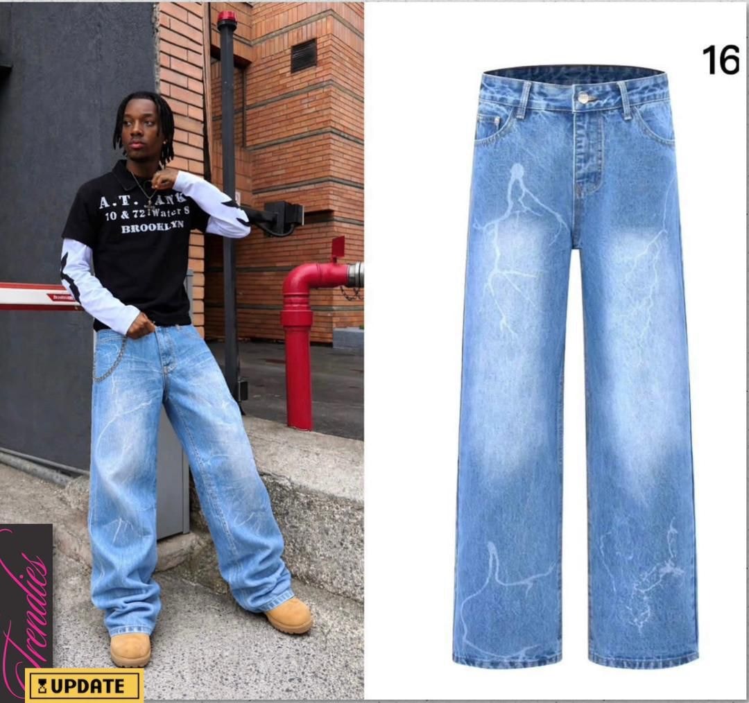 Light blue baggy jeans with white lightning and crack patterns throughout.
