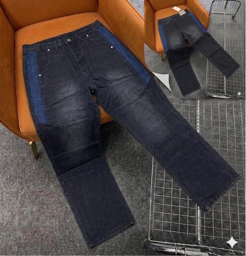 Dark jeans with blue side panels containing text and cargo pockets.