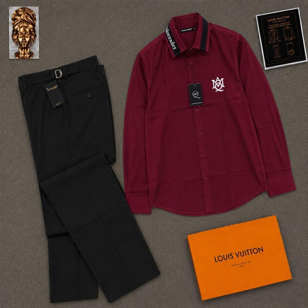 Burgundy long sleeve McQueen logo shirt paired with black trousers and orange box.